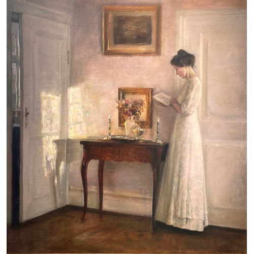 A lady reading in an interior